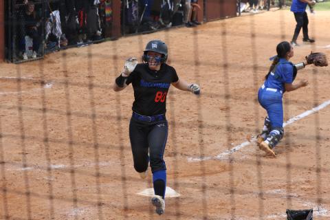Branford catcher Morgan Brennan smiles as she scores the first run of the 1A state semifinals game against defending champion Jay Monday at Legends Ballfield. (MORGAN MCMULLEN/Lake City Reporter)