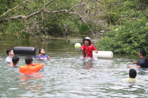 A group of park visitors plays an impromptu game of volleyball Monday afternoon at Ichetucknee Springs State Park. (MORGAN MCMULLEN/Lake City Reporter)