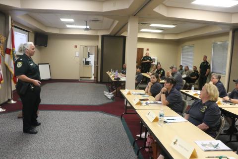 Columbia County Sheriff’s Office Maj. Katina Dicks (left) answers a question from a participant during Tuesday’s Citizen’s Law Enforcement Academy. (MORGAN MCMULLEN/Lake City Reporter)