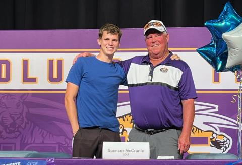Columbia golfer Spencer McCranie (left), pictured alongside CHS head coach Sherman Reed, signed his letter of intent to play at Tennessee State University on Thursday. (COURTESY)