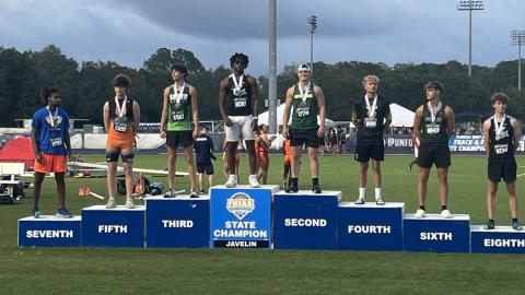 Suwannee junior Will Wainwright stands on the podium Thursday at Hodges Stadium in Jacksonville after finishing second in the javelin in Class 2A. (COURTESY)