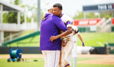 Columbia assistant coach Tracy Brinkley (left) hugs shortstop Brayden Thomas following the Tigers’ 5-2 loss to American Heritage in the Class 5A state semifinals on Monday at Hammond Stadium in Fort Myers. (JESSICA PILAND/Special to the Reporter)