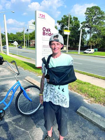 Brandy Dent is pictured at the Oak Bridge office building Friday, two days after she said she helped stop a car from backing over a child. (JAMIE WACHTER/Lake City Reporter)