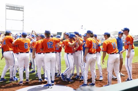 Florida players celebrate after Josh Rivera batted in Wyatt Langford (center) with a home run against TCU in the first inning of Wednesday's College World Series game in Omaha, Neb. (REBECCA S. GRATZ/Associated Press)