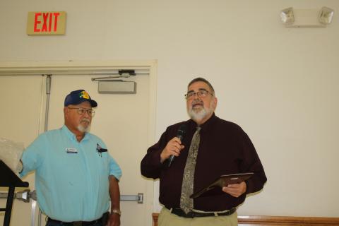 Columbia County Manager David Kraus speaks Tuesday after receiving the Columbia County Farm Bureau’s Public Service Award from Richard Jones. (TONY BRITT/Lake City Reporter)