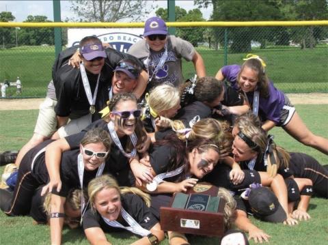 Columbia’s 2013 softball team celebrates in a dogpile after defeating Pembroke Pines Charter to win the Class 6A state championship on May 12, 2013, at the Vero Beach Sports Village. (FILE)