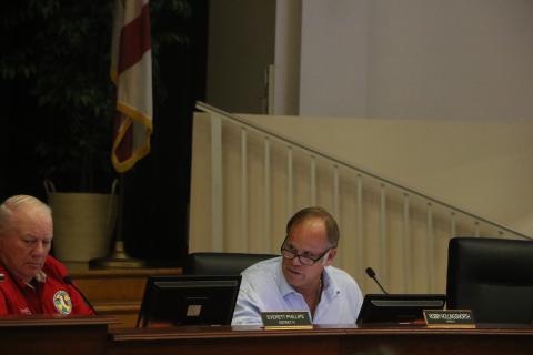 Columbia County Commissioner Robby Hollingsworth (right) speaks next to Commissioner Everett Phillips during Waste Pro’s presentation at the commission’s meeting Thursday night. (MORGAN MCMULLEN/Lake City Reporter)