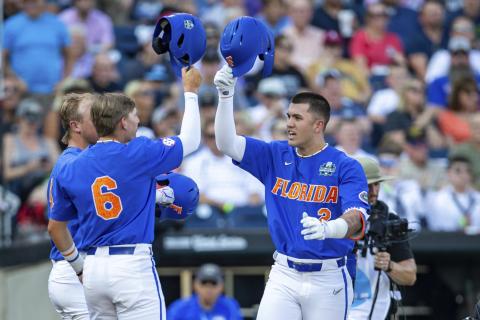 Florida outfielder Ty Evans (2) celebrates after his home run with Tyler Shelnut (6) in the second inning against Oral Roberts in their College World Series contest Sunday in Omaha, Neb. (JOHN PETERSON/Associated Press)