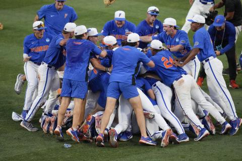 JOHN RAOUX/Associated Press Florida players and coaches celebrate on the field after defeating South Carolina in the Gainesville Super Regional game on Saturday.