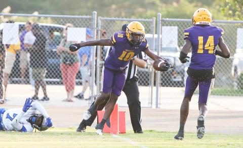 Columbia receiver Zamarion Jones (10) celebrates with receiver Jasper White (14) after scoring a touchdown against Bartram Trail during the teams’ spring game on May 19. (BRENT KUYKENDALL/Lake City Reporter)