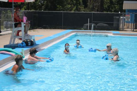 Lifeguard Rachel Douberley leads a water aerobics class at the Jared Allison Aquatic Complex. (TONY BRITT/Lake City Reporter)