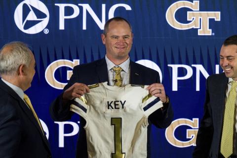 Newly hired Georgia Tech football coach Brent Key holds up a jersey during a news conference on Dec. 5, 2022, in Atlanta. (AP FILE)