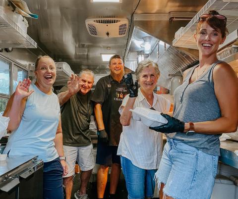 Robert and Emmie Chasteen sold their Chasteen’s Still Truckin’ food truck to Cammy and Ben Scott and Holly and Jonny Frazier. The rebranded truck, Cluckin’ and Truckin’ will hopefully start serving next week. The Chasteens helped Cammy Scott (left), Jonny Frazier (middle) and Holly Frazier (right) during a private event. (COURTESY)