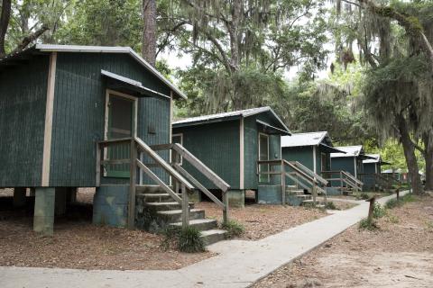 The historic cabins at Florida 4-H Camp Cherry Lake in 2019 before they were removed. Florida 4-H is aiming to raise $3.5 million to construct five new cabins at the camp in Madison County. (COURTESY)