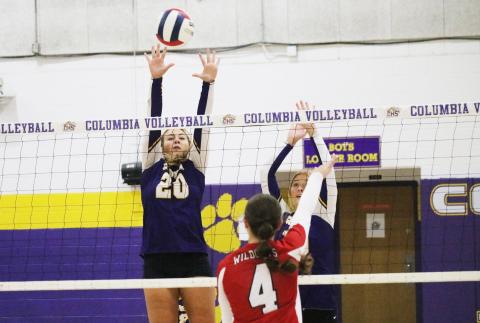 Columbia’s Cassidy O’Neal (20) and Avery Sandlin (right) try to block a shot from Baker County on Thursday night. (JORDAN KROEGER/Lake City Reporter)