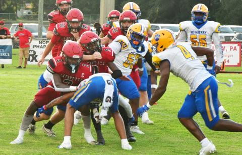 Lafayette quarterback Tywan Williamson is tackles by a host of Newberry defenders during last Friday's Preseason Classic. (ROB WOLFE/Special to the Reporter)