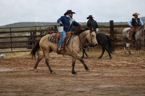 Jared Lee, a cowboy from Suwannee County, carries a bucket of water during a challenge on the fourth season of the ‘Ultimate Cowboy Showdown.’ The winner receives a herd of cattle as well as a belt buckle. (COURTESY INSP)