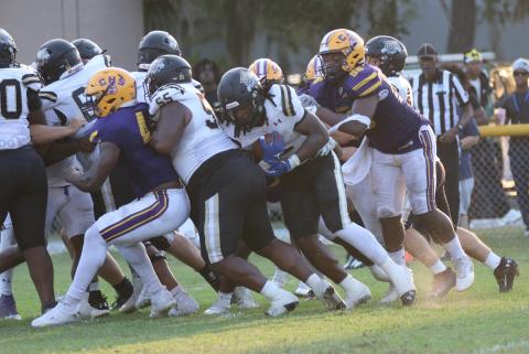 Buchholz running back Myles Graham pushes across the goal line for a touchdown against Columbia on 4th-and-goal Saturday night. (JORDAN KROEGER/Lake City Reporter)