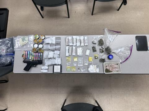 A traffic stop Saturday led to two arrests after Lake City police officers found a variety of narcotics and a firearm in the vehicle. (COURTESY LCPD)