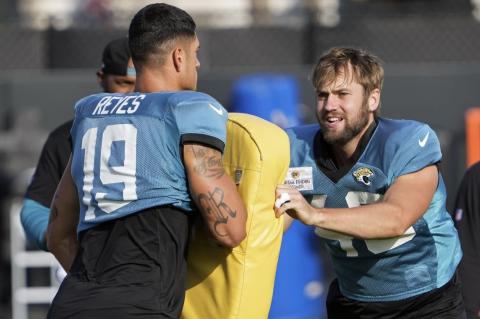 Jacksonville Jaguars tight end Josh Pederson (right) runs through a drill with tight end Samuel Reyes (19) during a practice on Tuesday in Jacksonville. (JOHN RAOUX/Associated Press)