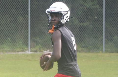 Fort White quarterback Jayden Jackson sets to throw a pass during Monday’s practice. (MORGAN MCMULLEN/Lake City Reporter)