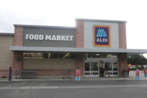 A shopper enters the Aldi store in Lake City on Wednesday afternoon. The Germany-based company announced Wednesday it plans to buy 400 Winn-Dixie and Harveys stores in the southeast. (MORGAN MCMULLEN/Lake City Reporter)