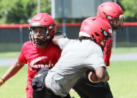 Lafayette’s Jalen Hill shakes off linebacker Trevor Mares during practice on Aug. 1. (JAMIE WACHTER/Lake City Reporter)