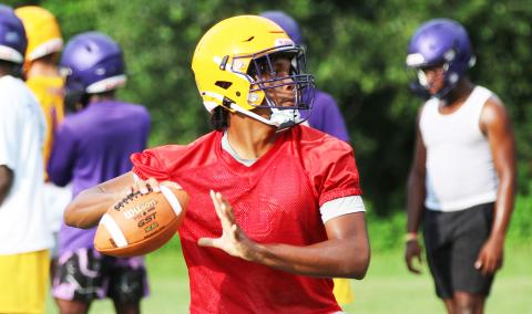 Columbia quarterback Zack Paulk drops back to pass during Monday’s practice. (JORDAN KROEGER/Lake City Reporter)