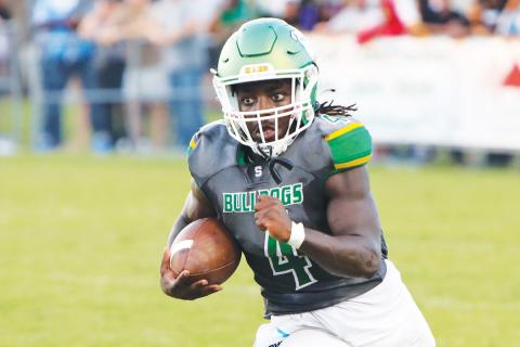Suwannee running back Marquavious Owens rushes up the field against Columbia during Friday’s Preseason Classic. (BRENT KUYKENDALL/Lake City Reporter)