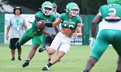 Suwannee defensive end Ja’Darius Cherry sacks quarterback Kodi Lang during Friday’s scrimmage. (JAMIE WACHTER/Lake City Reporter)
