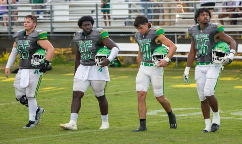 Suwannee captains Andrew Harrell (65), Justice Leggett (55), Kodi Lang (10) and Jadarius Cherry (56) walk out on to the field for the coin toss prior to last Friday’s Preseason Classic against Columbia. (BRENT KUYKENDALL/Lake City Reporter)
