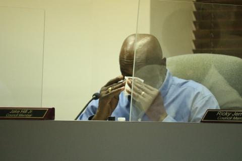 Lake City Councilman Jake Hill Jr. wipes his eyes while talking about Mariah Smith, a close family friend. Smith, 12, was shot and killed last month. The council supported designating NW Long Street in her honor. (JAMIE WACHTER/Lake City Reporter)