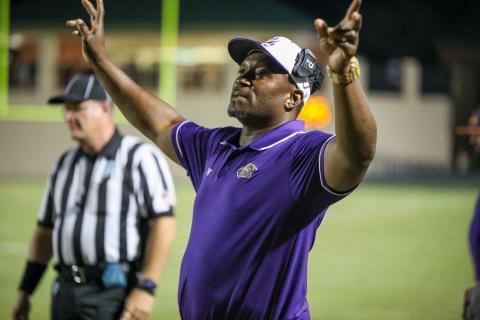 Columbia head coach Brian Allen signals in a play to his offense during Friday’s game against DeLand. (BRENT KUYKENDALL/Lake City Reporter)