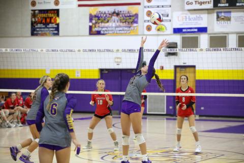 Columbia setter Mylie Fernandez (7) passes a shot to a teammate against Lafayette on Tuesday night. (BRENT KUYKENDALL/Lake City Reporter)