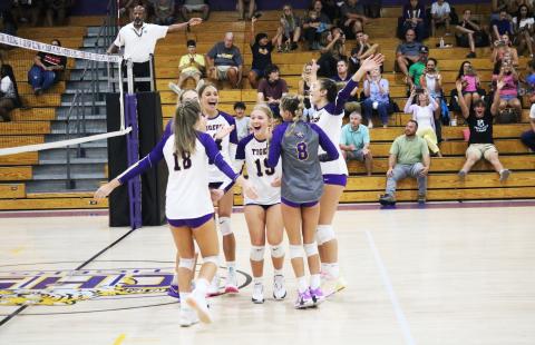 Columbia celebrates after scoring the final point to sweep Bradford on Thursday night. (JORDAN KROEGER/Lake City Reporter)