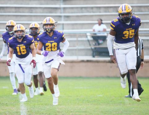 Columbia defensive back Julian De La Cruz (28) and linebacker Chris Jordan (35) celebrate after making a tackle on a kickoff return against Buchholz on Aug. 26.