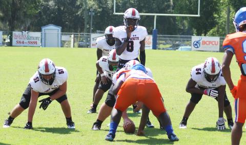 Fort White quarterback Jayden Jackson gets set for the snap against Taylor County on Aug. 26. (JAMIE WACHTER/Lake City Reporter)