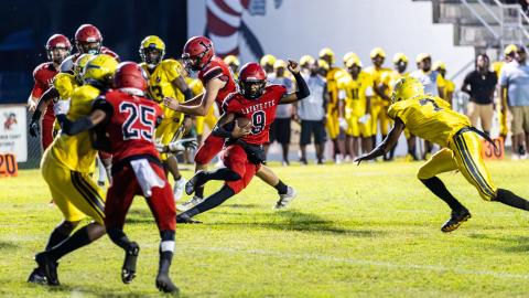 Lafayette quarterback Tywan Williamson scrambles up the field against Zarephath Academy last Friday. (JACK HOWDESHELL/Special to the Reporter)