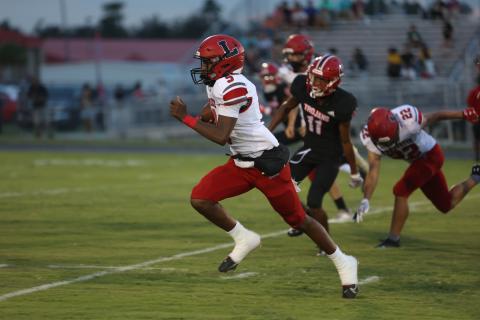 Lafayette quarterback Tywan Williamson races upfield during Friday’s 53-6 win over Hamilton County. (PAUL BUCHANAN/Special to the Reporter)