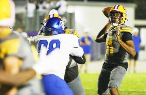 Columbia quarterback Zack Paulk throws a pass against Trinity Christian on Friday. (BRENT KUYKENDALL/Lake City Reporter)