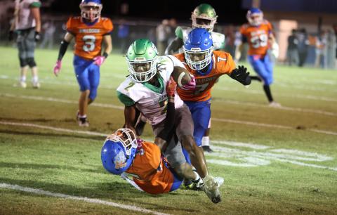 Suwannee receiver Amarion Rojas runs over a Taylor County on Friday night. (PAUL BUCHANAN/Lake City Reporter)