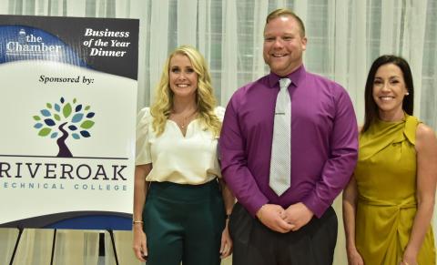 RIVEROAK Technical College’s TJ Vickers, who shoots video commercials for all the finalists, is pictured with Suwannee County Chamber of Commerce Executive Director Hilary Cannon (left) and President Hannah Skinner at last year’s Business of the Year dinner. (FILE)