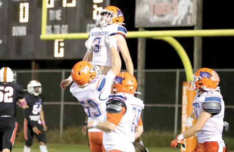 Branford wide receiver Haiden Ward and offensive lineman Sabastian Waugama celebrate after Ward’s touchdown in the second quarter Friday against Trenton. (ERIN ROBERTS/Special to the Reporter)