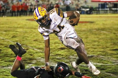 Columbia quarterback Xavier Collins scrambles past a Middleburg defender on Oct. 13. (BRENT KUYKENDALL/Lake City Reporter)