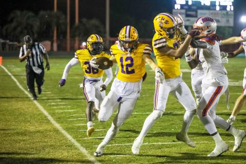 Columbia receiver Camdon Frier (12) tip-toes the sideline after a catch against Bolles on Friday. (BRENT KUYKENDALL/Lake City Reporter)