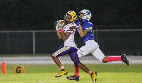 Columbia receiver Marlin Haywood catches a touchdown pass against Ridgeview on Friday night. (BRENT KUYKENDALL/Lake City Reporter)