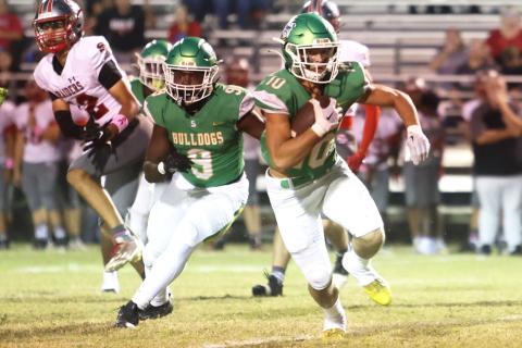 Suwannee safety Kodi Lang returns an interception in the first quarter Friday against Santa Fe. (PAUL BUCHANAN/Special to the Reporter)