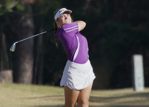Columbia golfer Karlee Gainey watches her shot during Monday’s tri-match against Branford and Chiefland at Quail Heights. (COURTESY)