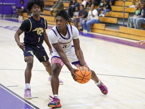 Columbia guard Zamarion Jones drives into the lane against St. John Paul II during Thursday's preseason game. (BRENT KUYKENDALL/Lake City Reporter)