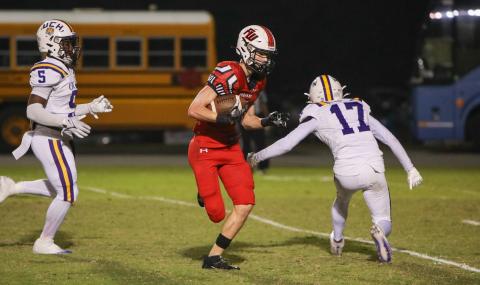 Fort White receiver Garrett Brady makes a Union County defender miss on his way to the end zone for a touchdown during Friday’s Region 3-1R semifinal. (BRENT KUYKENDALL/Lake City Reporter)